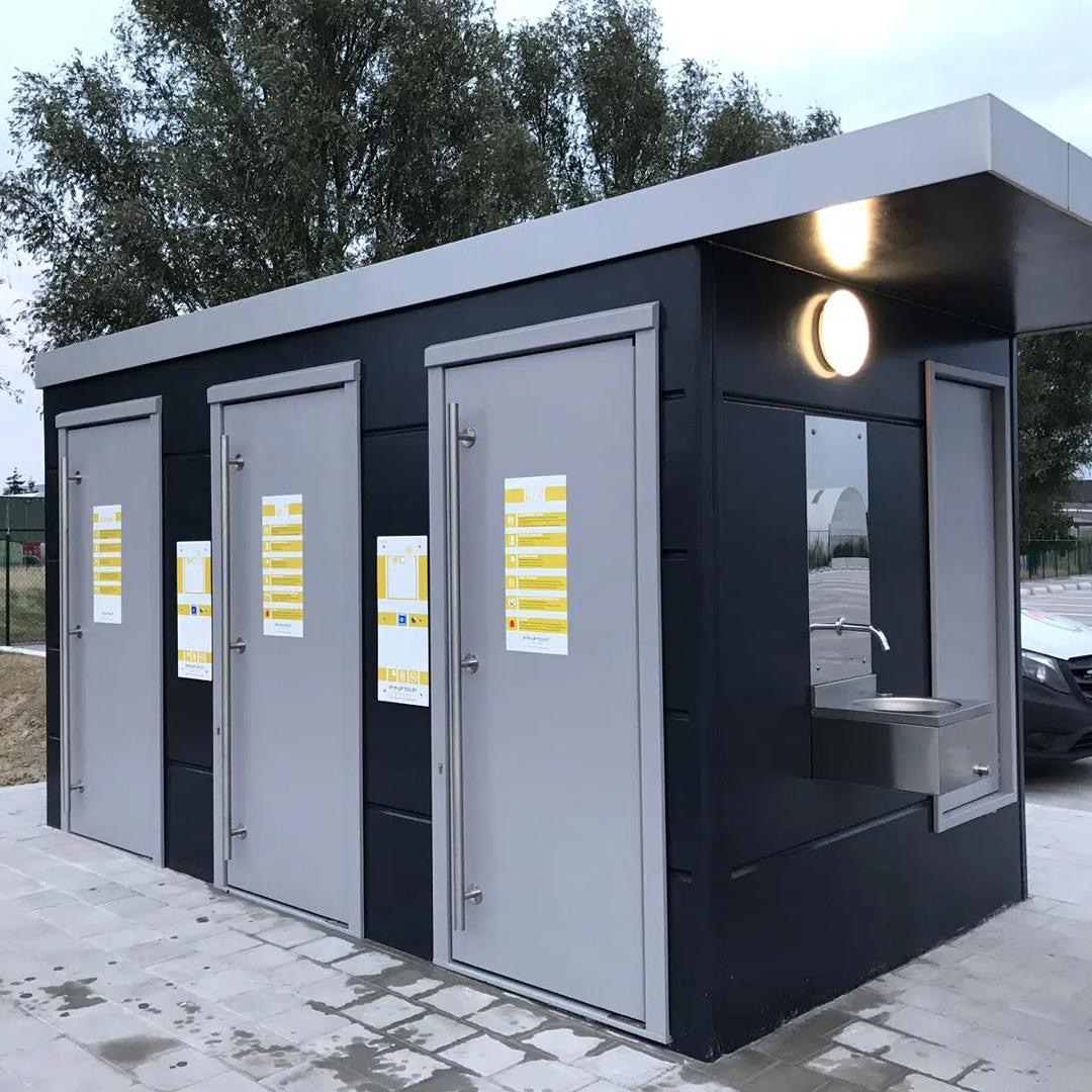 Modern modular public toilet exterior with handwashing station